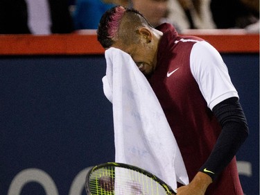 Nick Kyrgios (AUS) wipes his face between games as he faces Stan Wawrinka (SUI) during Rogers Cup action in Montreal on Wednesday August 12, 2015.
