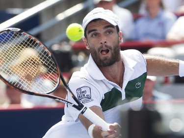 Pablo Andujar from Spain, returns ball  close to the net, during his match against Kei Nishikori from Japan, during Rogers Cup action in Montreal on Wednesday August 12, 2015.