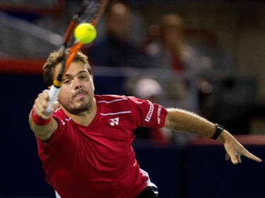 Stan Wawrinka (SUI) returns the ball to Nick Kyrgios (AUS) during Rogers Cup action in Montreal on Wednesday August 12, 2015.