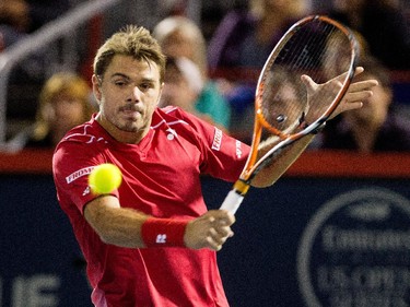 Stan Wawrinka (SUI) returns the ball to Nick Kyrgios (AUS) during Rogers Cup action in Montreal on Wednesday August 12, 2015.