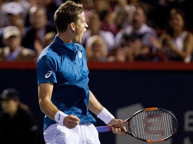 Vasek Pospisil (CAN) celebrates winning the second set, forcing a third set against John Isner (USA) during Rogers Cup action in Montreal on Wednesday August 12, 2015.