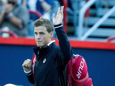 Vasek Pospisil (CAN) waves to the crowd as he arrives for his match against John Isner (USA) during Rogers Cup action in Montreal on Wednesday August 12, 2015.