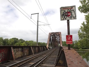 An 18-year-old is in critical condition in hospital after attempting climb a bridge connecting Montreal and Laval.