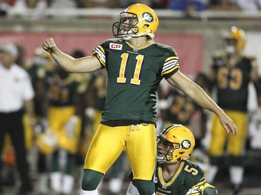 Edmonton Eskimos kicker Grant Shaw and holder Jordan Lynch watch Shaw's game winning field goal on the last play of the game during Canadian Football League action against the Alouettes in Montreal Thursday August 13, 2015.