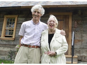 Judith Duncanson from the Paul Holland Knowlton House Committee, right, and retired architect David Kininmonth pose in front of the historic Paul Knowlton House. The house was saved from demolition last year and restored. It will open to the public for the first time on Saturday, Aug. 15, 2015, at its new home at the Brome County Historical Society Museum located in Knowlton in the Eastern Townships.