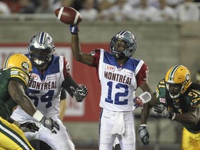 Alouettes offensive-lineman Jeff Perrett, left, protects QB Rakeem Cato last season. Perrett could be called upon to move to the crucial left-tackle position this year after Josh Bourke jumped to the Argonauts in free agency last week.