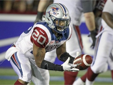 Montreal Alouettes running back Tyrell Sutton catches a pass from quarterback Rakeem Cato during Canadian Football League game against the Edmonton Eskimos in Montreal Thursday August 13, 2015.