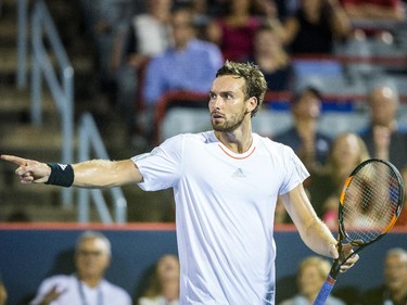 Ernests Gulbis of Latvia reacts after losing a point against Novak Djokovic of Serbia during their quarter-finals tennis match for the Roger's Cup Tennis Tournament at Uniprix Stadium in Montreal on Friday, August 14, 2015.