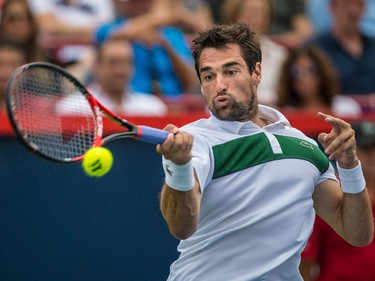 Jeremy Chardy of France hits a return against John Isner of the United States during their quarter-finals tennis match for the Roger's Cup Tennis Tournament at Uniprix Stadium in Montreal on Friday, August 14, 2015.