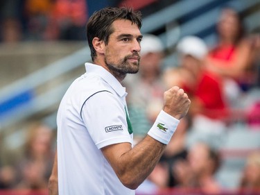 Jeremy Chardy of France reacts after scoring a point against John Isner of the United States during their quarter-finals tennis match for the Roger's Cup Tennis Tournament at Uniprix Stadium in Montreal on Friday, August 14, 2015.