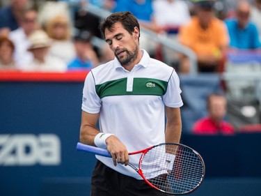 Jeremy Chardy of France reacts after losing a point against John Isner of the United States during their quarter-finals tennis match for the Roger's Cup Tennis Tournament at Uniprix Stadium in Montreal on Friday, August 14, 2015.