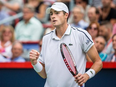 John Isner of the United States reacts after scoring a point against Jeremy Chardy of France during their quarter-finals tennis match for the Roger's Cup Tennis Tournament at Uniprix Stadium in Montreal on Friday, August 14, 2015.