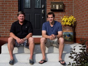 The Canadiens' Torrey Mitchell sits with his father, Steve, on the front steps of the Greenfield Park home he grew up in on the South Shore of Montreal on Aug. 14, 2015.