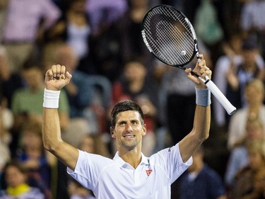 Novak Djokovic of Serbia celebrates after beating Ernests Gulbis of Latvia during their quarter-finals tennis match for the Roger's Cup Tennis Tournament at Uniprix Stadium in Montreal on Friday, August 14, 2015.
