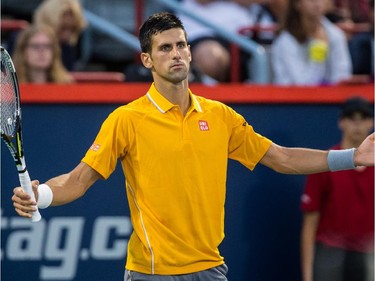 Novak Djokovic of Serbia reacts after losing a point against Ernests Gulbis of Latvia during their quarter-finals tennis match for the Roger's Cup Tennis Tournament at Uniprix Stadium in Montreal on Friday, August 14, 2015.