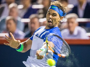 Rafael Nadal of Spain hits a return against Kei Nishikori of Japan during their quarter-finals tennis match for the Roger's Cup Tennis Tournament at Uniprix Stadium in Montreal on Friday, August 14, 2015.