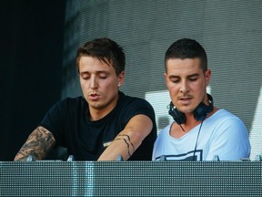 Idir Makhlaf, right, and Thom Jongkind, left, of Blasterjaxx perform at the ÎleSoniq music festival at Jean-Drapeau Park in Montreal on Saturday, August 15, 2015.