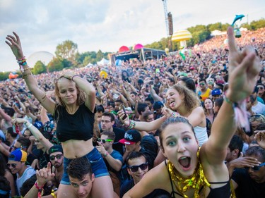 Music fans enjoy the performance by the Dutch DJ duo Showtek at the ÎleSoniq music festival at Jean-Drapeau Park in Montreal on Saturday, August 15, 2015.