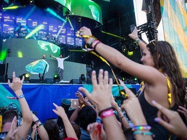 Music fans enjoy the performance by the Dutch DJ duo Showtek at the ÎleSoniq music festival at Jean-Drapeau Park in Montreal on Saturday, August 15, 2015.