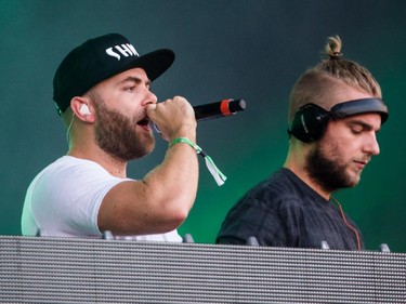 MONTREAL, QUE.: AUGUST 15, 2015 -- Sjoerd Janssen, left, and Wouter Janssen of the dutch electronic DJ duo Showtek perform at the IleSoniq music festival at Jean-Drapeau park in Montreal on Saturday, August 15, 2015. (Dario Ayala / Montreal Gazette)