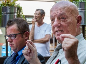 Peter Sergakis speaks to the media alongside UTBQ lawyer Sebastien Senechal outside the Sky bar in Montreal on Tuesday, Aug. 18, 2015.