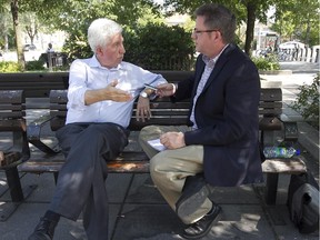 Bloc Québécois Leader Gilles Duceppe, left, speaks with Montreal Gazette reporter Phil Authier during a campaign stop at Maisonneuve Market on Wednesday Aug.19, 2015.