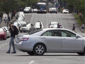 A Montreal taxi turns on René-Lévesque W from Jeanne-Mance on Thursday August 20, 2015.