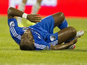 Didier Drogba of the Montreal Impact writhes on the turf after taking a hit against the Philadelphia Union in MLS action at Saputo Stadium in Montreal on Sat., Aug. 22, 2015.