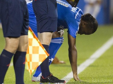 International soccer superstar from the Ivory Coast Didier Drogba touches the turf as he prepares to come into the game in his debut for the Montreal Impact against the Philadelphia Union in M.L.S. action at Saputo Stadium in Montreal Saturday, August 22, 2015.