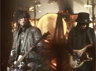 Hard-rock veterans Mötley Crüe are on their farewell tour. Nikki Sixx, at the bass, left, with Tommy Lee at the drums, middle and Mick Mars, right, at the guitar perform at the Bell Centre in Montreal, Monday August 24, 2015.