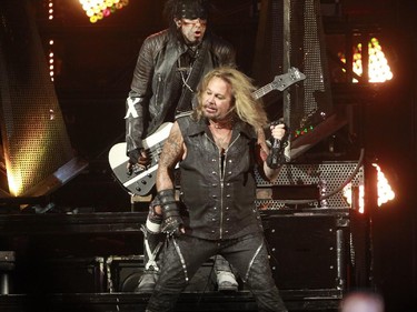 Hard-rock veterans Mötley Crüe are on their farewell tour. Nikki Sixx, at the bass, top, with lead singer Vince Neil perform at the Bell Centre in Montreal, Monday August 24, 2015.