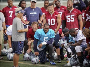 Montreal Alouettes coach and general manager Jim Popp addresses the team at the end of practice in Montreal Monday August 24, 2015.