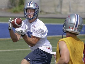 Alouettes reciever Samuel Giguère catches a long pass during practice in Montreal Monday, Aug. 24, 2015.