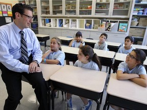 Steven Erdelyi, head of school at Solomon Schechter Academy, speaks with Grade 4 students, clockwise from back left: Alexis Cohen, Sean Liquornik, Ariel Nathan, Andie Berbrier, Alexandra Greenspoon and Kate Lisbona at the private school in Montreal Tuesday August 25, 2015.