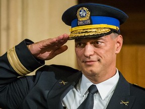 New chief of police for the Montreal police Philippe Pichet salutes during his swearing in ceremony at Montreal City Hall on Friday, August 28, 2015.