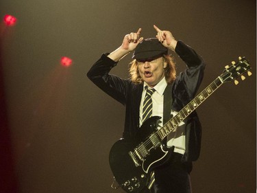 Guitarist Angus Young of the Australian hard rock band AC/DC makes devil's horns as he performs at the Olympic Stadium in Montreal Monday, August 31, 2015. The rockers AC/DC were back in town in support of last year's Rock or Bust album.