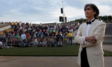 Kent Nagano waits to take the stage to conduct the Orchestre symphonique de Montréal through excerpts from Bizet's Carmen in a free outdoor show on the esplanade of the Olympic Park in Montreal on Wednesday August 5, 2015.