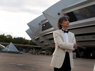 Kent Nagano waits to take the stage to conduct the Orchestre symphonique de Montréal through excerpts from Bizet's Carmen in a free outdoor show on the esplanade of the Olympic Park in Montreal on Wednesday August 5, 2015.