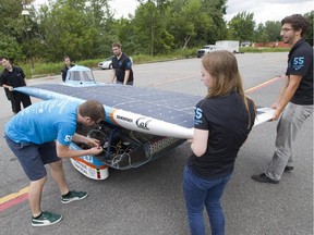 Students prepare Esteban VII for driving, a solar vehicle from the Ecole Polytechnique in Montreal, Thursday, Aug. 6, 2015. Her team won second place in the Formula Sun Grand Prix, an international competition held in Texas earlier this year.