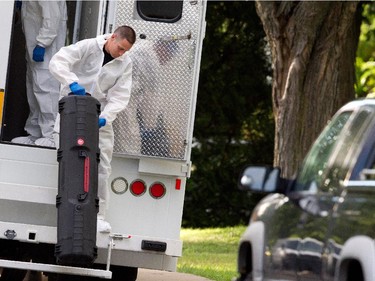 Sureté du Québec police arrive to search the home of Cheryl Bau-Tremblay after her body was found inside the Beloeil home near Montreal on Thursday August 6, 2015.