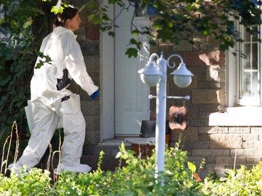 Sureté du Québec police search the home of Cheryl Bau-Tremblay after her body was found inside the Beloeil home near Montreal on Thursday August 6, 2015.