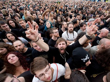 Fans cheer as Meshuggah performs at Heavy Metal Montreal at Parc Jean-Drapeau in Montreal on Friday August 7, 2015.