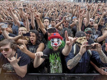 Heavy Montreal fans cheer as Arch Enemy takes the stage to perform at Heavy Metal Montreal at Parc Jean-Drapeau in Montreal on Friday August 7, 2015.