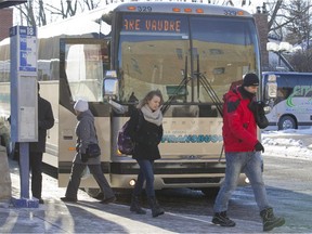 Buses drop off commuters at the Vaudreuil train station.