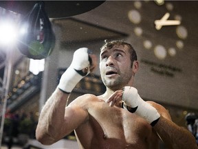 Boxer Lucian Bute from Montreal hits the speed bag as he trains at Complexe Desjardins in Montreal on Jan. 13, 2014.