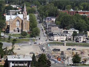 Trucks move about the disaster zone in the town of Lac-Mégantic on Friday, July 3, 2015.