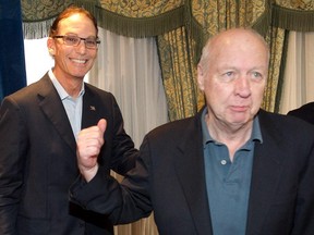 “I’ll be surrounded by a lot of people who are much better than I am,” humble Alouettes owner Bob Wetenhall, right, with head coach Marc Trestman in 2012, says of his induction into the Canadian Football Hall of Fame. (Pierre Obendrauf / THE GAZETTE)