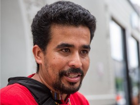 Former migrant worker Noe Arteaga Santos speaks to the media during a rally organized in his support by the "Justice for Noe Committee" in Montreal on Sunday, July 19, 2015. A human rights tribunal in 2014 found that Santos was fired by the tomato producer Savoura without just or sufficient cause. Savoura declared bankruptcy before a compensation agreement was reached though the label is still in existence.