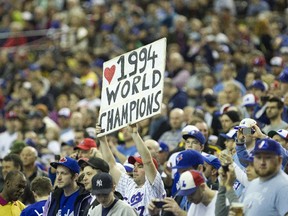 Expos fans salute members of the 1994 team during a pre-game ceremony at the Olympic Stadium before a pre-season game between the Toronto Blue Jays and New York Mets in Montreal on March 29, 2014.