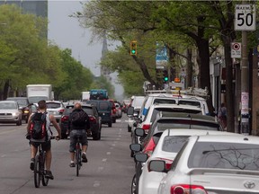 Cyclists makes their way south on St-Denis near Rachel in the Plateau on Thursday May 22, 2014.